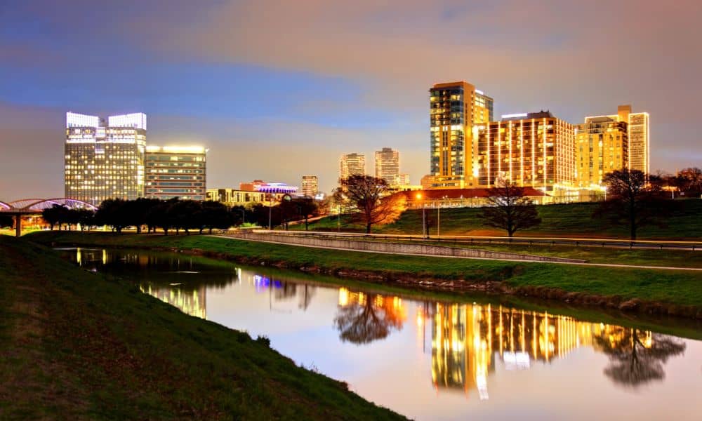 Fort Worth city skyline at dusk, representing the area served by ALTA land title survey professionals.
