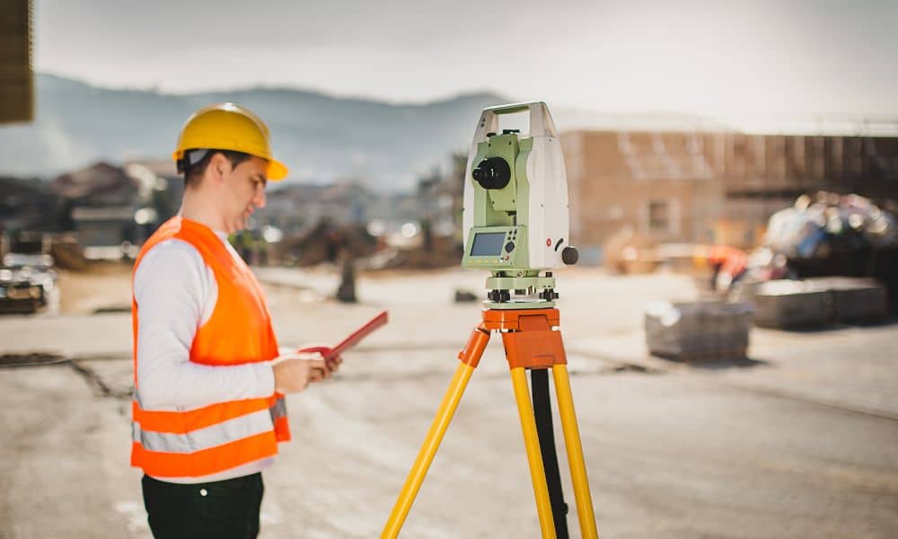 Commercial site surveying equipment - ALTA SURVEY Fortworth Surveyor using precision equipment during an ALTA land survey for a commercial development site