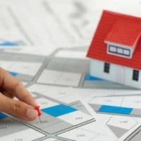 A boundary line survey showing property lines and recorded lot boundaries used to clarify fence locations