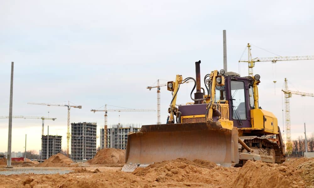 Bulldozer grading active construction site - ALTA SURVEY Fortworth Bulldozer grading an active construction site where control points must be protected during construction staking