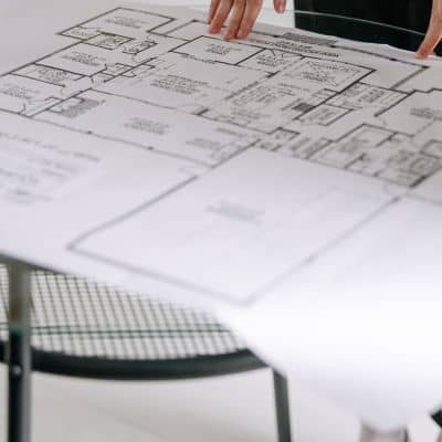 Data center site plans review - ALTA SURVEY Fortworth An engineering firm reviewing detailed site plans before beginning data center infrastructure work